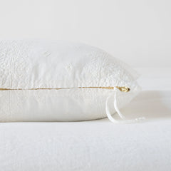 Side and zipper view of the Ines lumbar pillow in winter white from Bella Notte Linens.