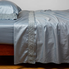 Bria Flat Sheet with Novola Lace from Bella Notte Linens in the color Tahoe Blue.