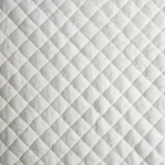 Silk Velvet Quilted Round Pillow from Bella Notte Linens in the color Winter White.
